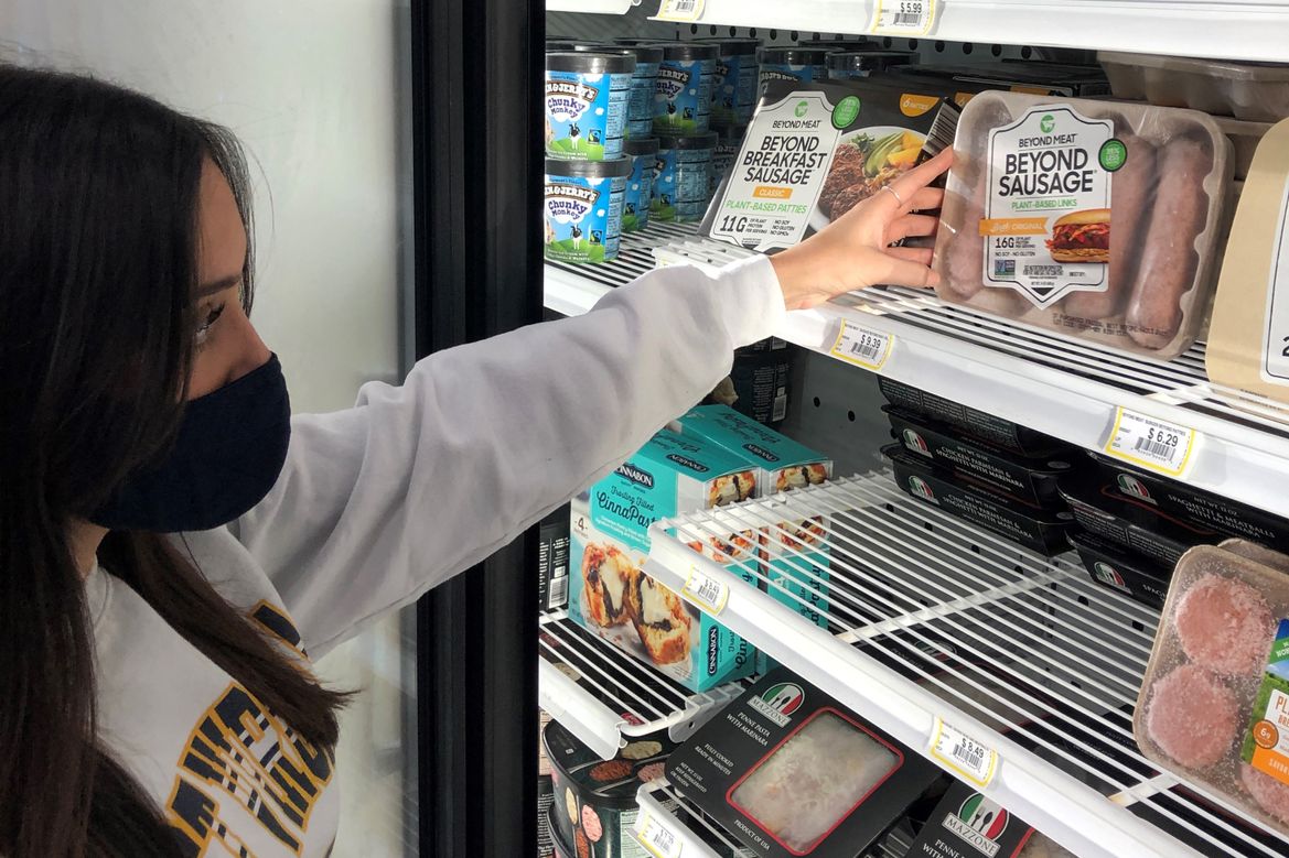 Student browsing beyond meat options in the grocery section at the Market @ UPlace