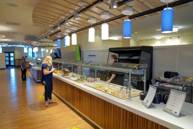 Customers looks at the available options on the buffet at Cafe Evansdale